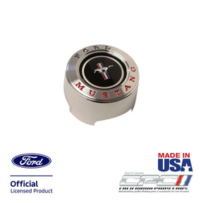 Angled front view of 1965-1966 Ford Mustang deluxe steering wheel center cap with Mustang tri-bar pony emblem and red Mustang lettering, OEM-style chrome finish, Ford Official Licensed Product, CPC part STE-656-048.